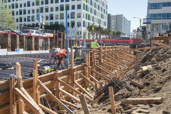 Construction crew installing rebar and concrete forms for Yerba Buena/Moscone Station on 4th Street.