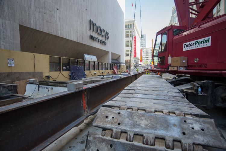 Construction vehicles and equipment parked at Macy's building site on Stockton Street in San Francisco.