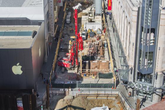 Overhead view of Stockton Street construction site with excavation equipment and surrounding buildings