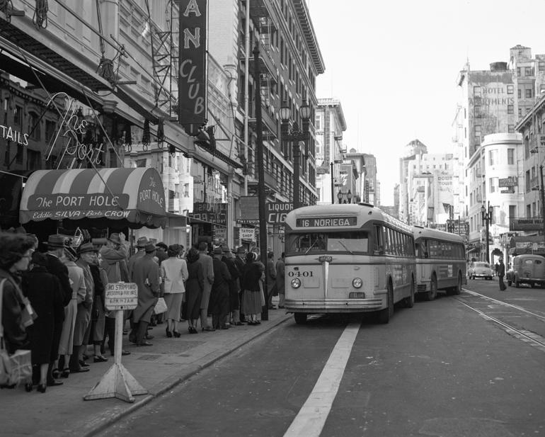 Vintage streetcar on Mason and Market Streets with pedestrians waiting on sidewalk, San Francisco 1951