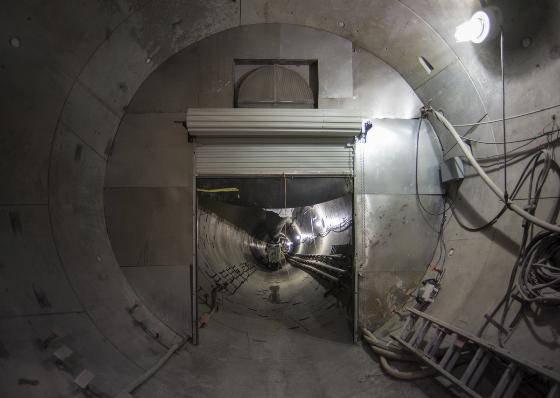Temporary roll-up door installed at southbound tunnel entrance during construction.