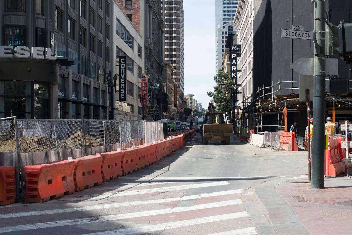 Construction barriers and equipment on Ellis Street between Powell and Stockton during street restoration work.