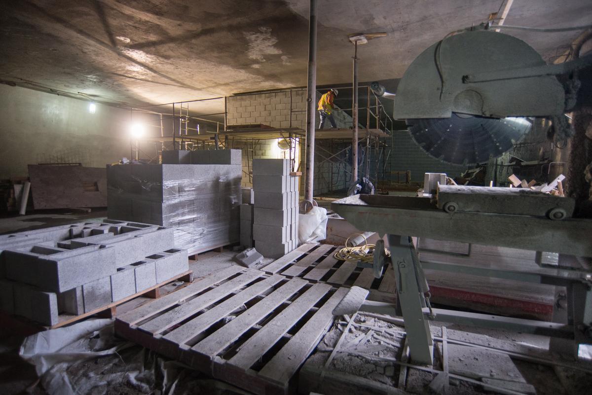 Underground transit station construction with interior walls and stairwells under development in station box.