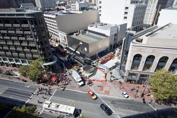 Aerial view of construction site on Stockton Street near Union Square with equipment, barriers, and street closure.
