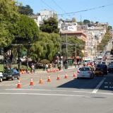 Northbound bus stop closure with traffic cones and construction equipment on Columbus Avenue at Union Street.