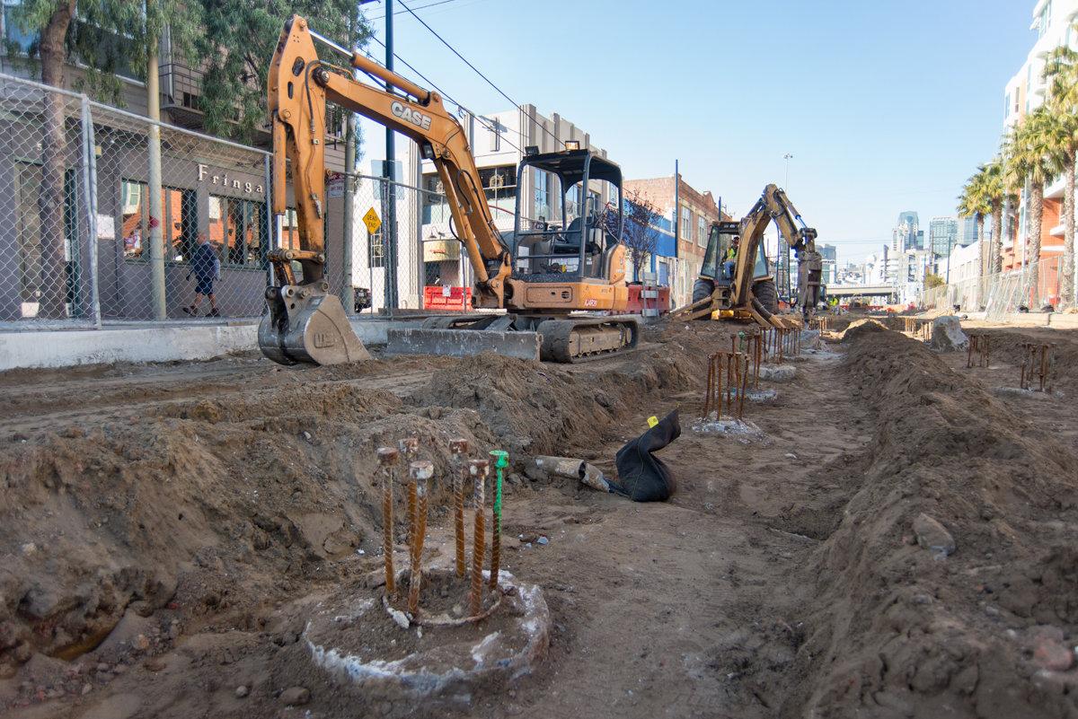 Excavation equipment and foundation work at 4th and Brannan surface station construction site.