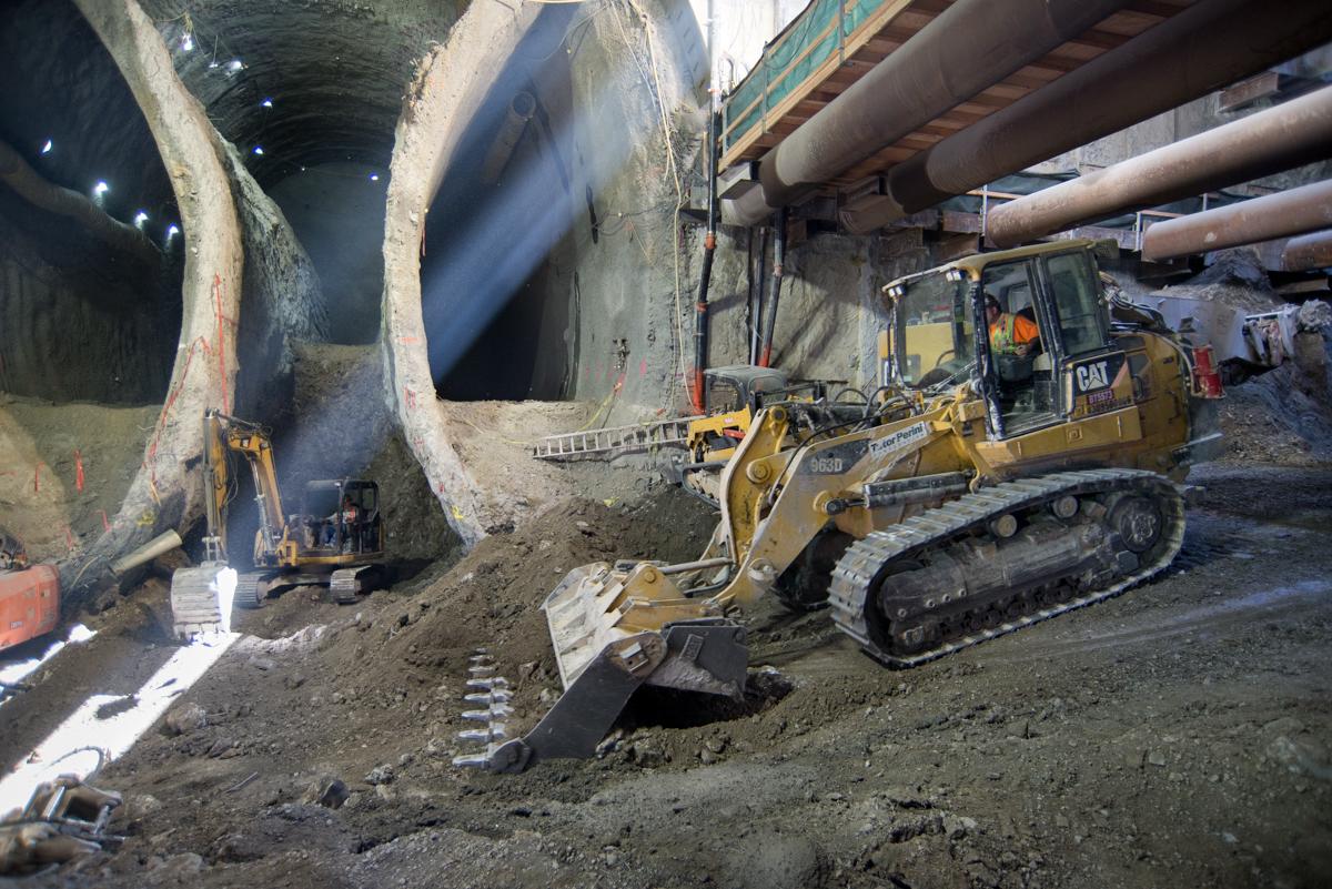 Bulldozer operating in underground excavation pit for Chinatown Station construction