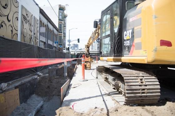 Construction equipment and trenching work on 4th Street for Central Subway project.