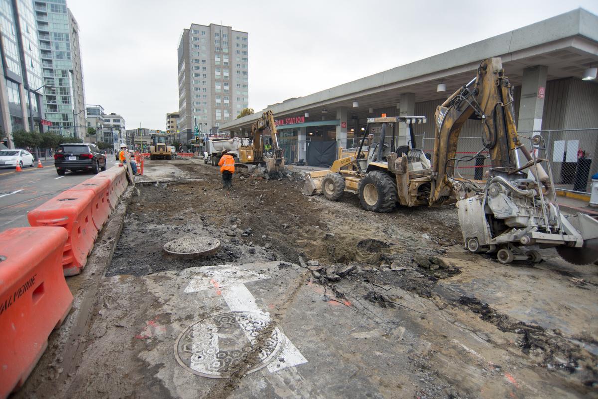 Construction equipment and workers on 4th Street during Central Subway project work between King and Bluxome.