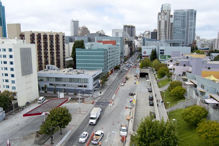 Aerial view of 4th Street showing construction zone with traffic controls, closed lanes, and surrounding urban buildings.