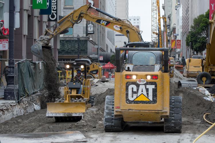 Construction equipment and excavation work on Stockton Street in downtown San Francisco.