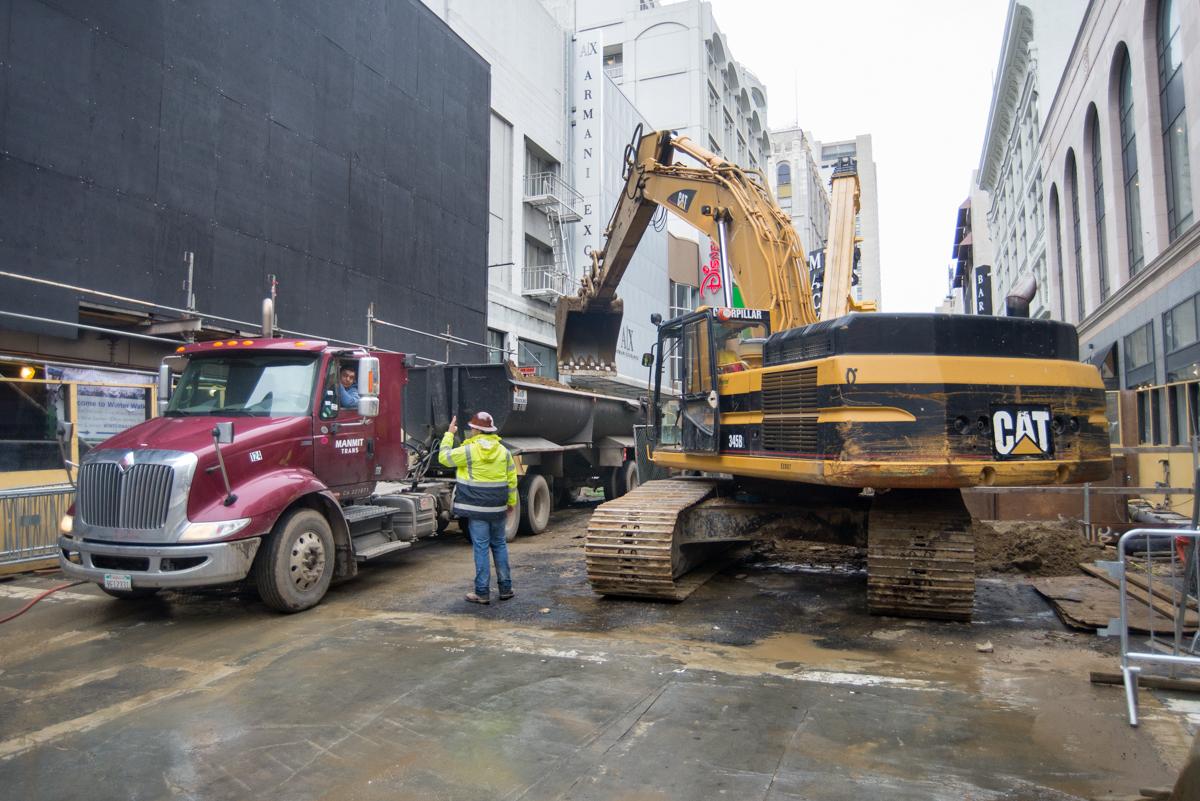 Construction equipment and dump truck at Stockton Street work zone between Geary and O'Farrell.
