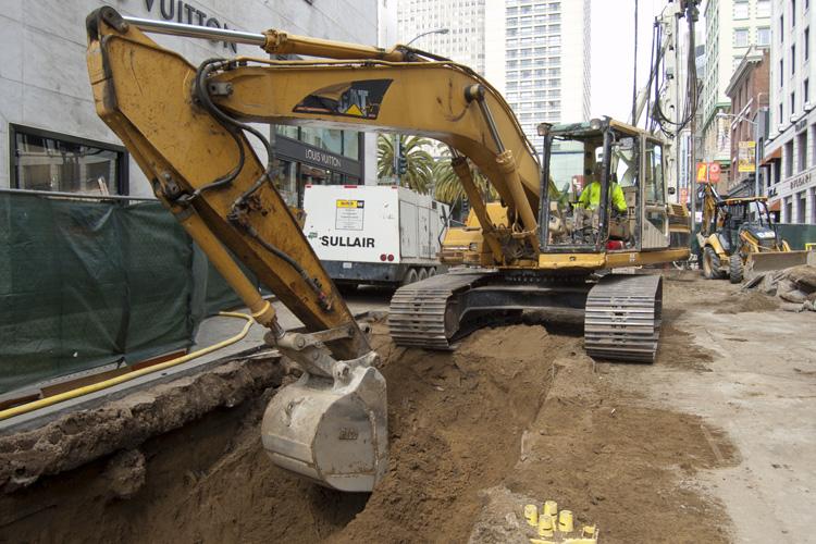Excavation equipment and machinery at Union Square/Market Street Station construction site on Stockton Street.