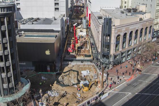 Aerial view of Union Square excavation site with construction equipment and surrounding buildings