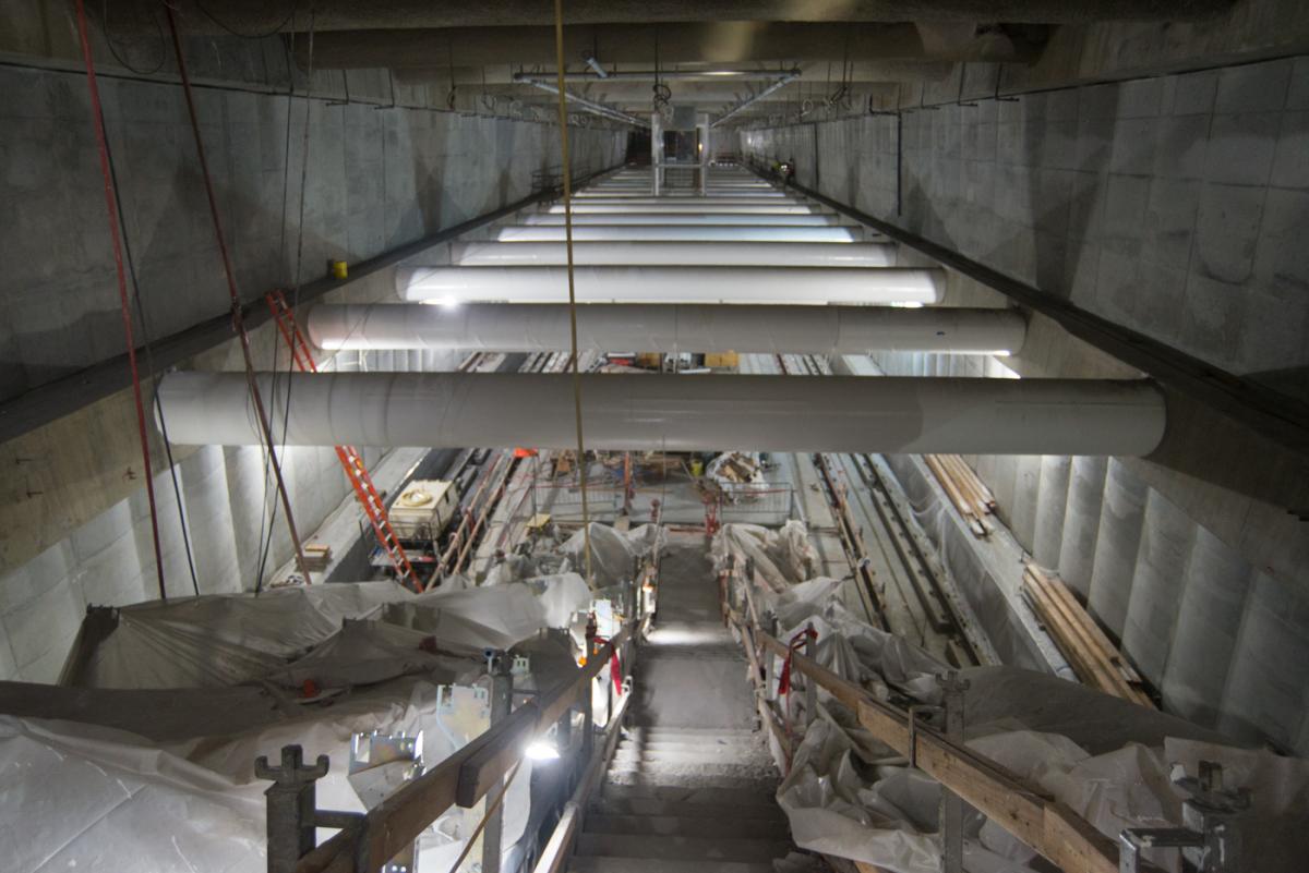 Union Square/Market Street Station platform viewed from south staircase, showing concrete structure and construction materials.