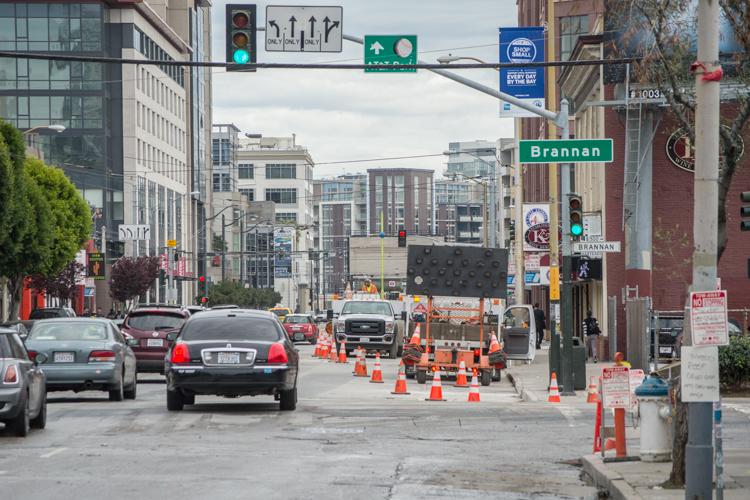 Construction work with orange cones on 4th Street at Brannan in San Francisco, with utility equipment and vehicles visible.