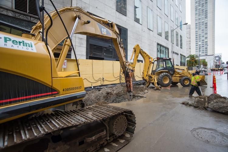 Construction equipment and workers on Stockton Street preparing for Union Square station construction.