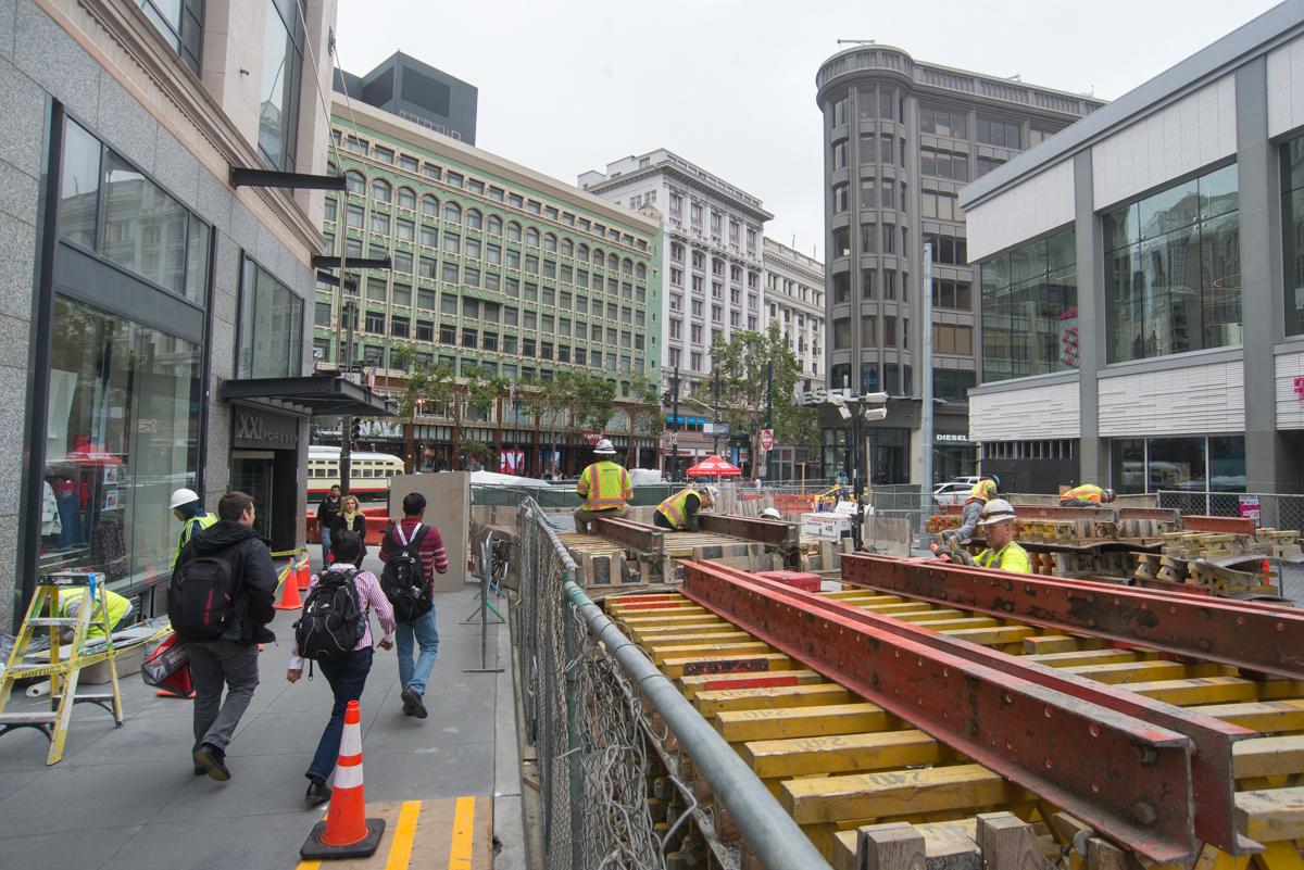 Construction crew works on street restoration at Stockton and O'Farrell intersection in downtown San Francisco.