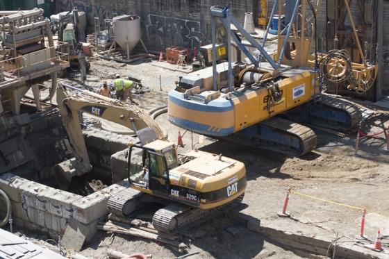 Construction equipment excavating at Stockton and Washington streets for future Chinatown Station.