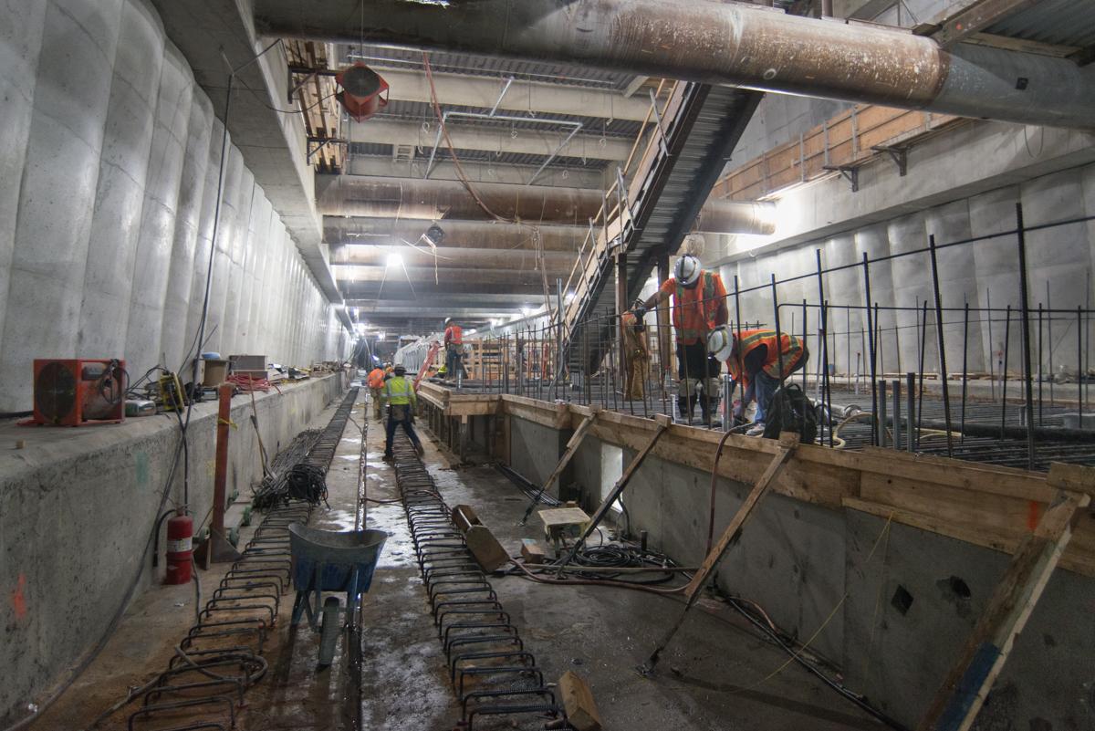 Construction workers install rebar on the platform of Union Square/Market Street Station during Central Subway construction.