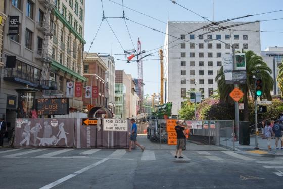 Stockton Street construction zone with lane closures, barriers, and street signage near Union Square.