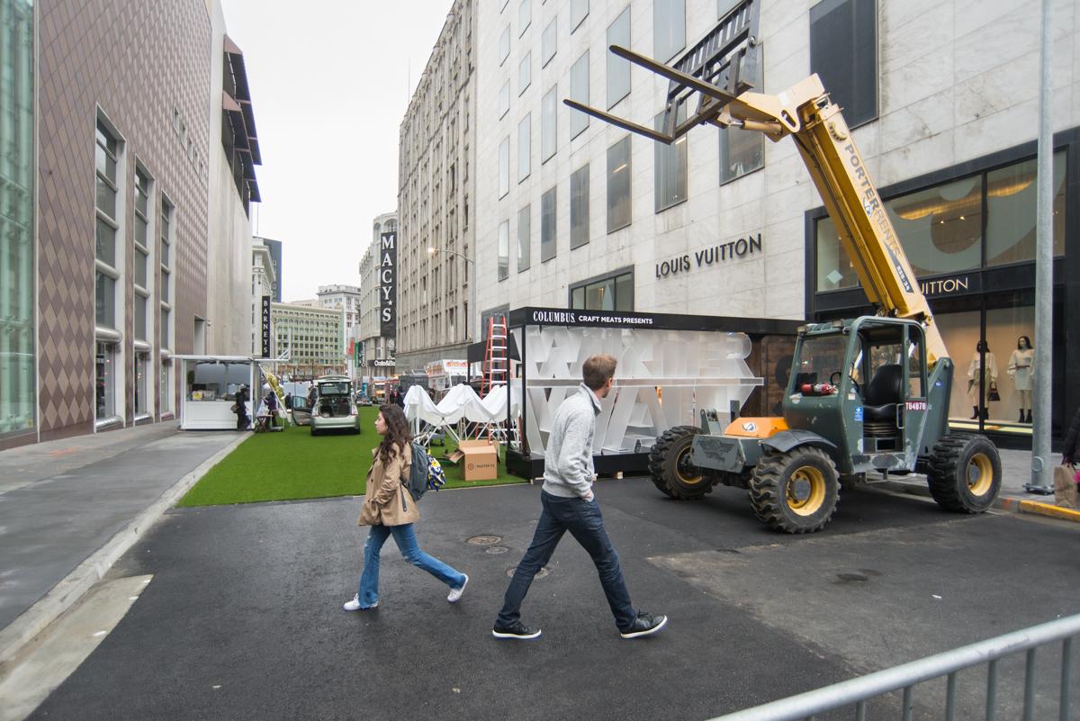 Construction crew operates a scissor lift on Stockton Street near Union Square in downtown San Francisco.