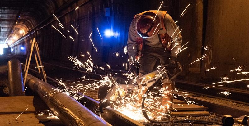 A man working on the Twin Peaks Tunnel.