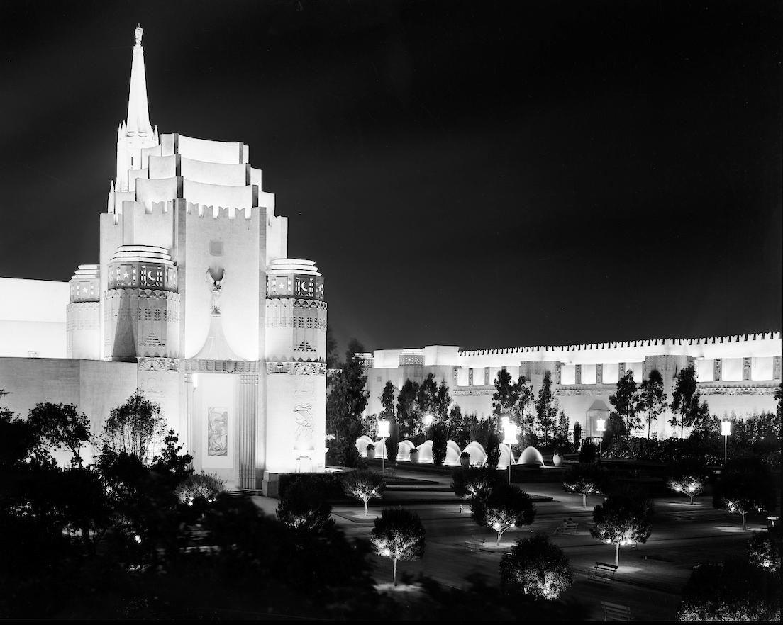 night view of buildings, fountains, and landscaping