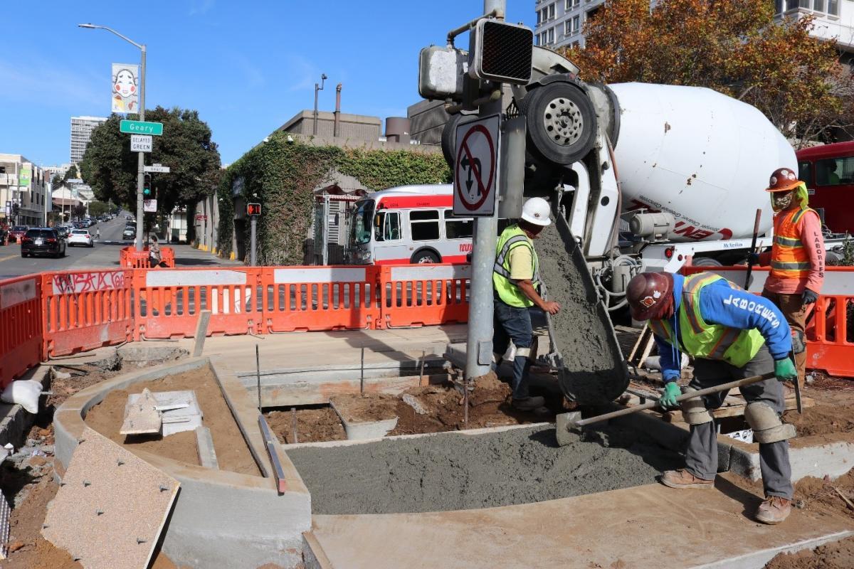 Photo of construction crew pouring concrete