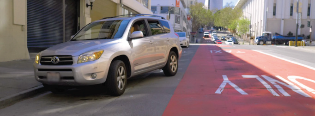 Car parallel parking adjacent to transit lane