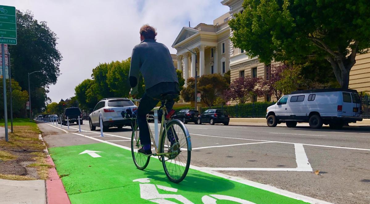 man biking on Fell Street bike path