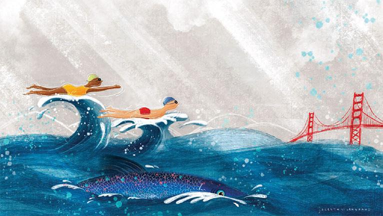Two swimmers riding waves with a fish in foreground and the Golden Gate Bridge in the distance