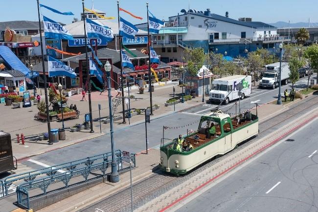 Photo of Pier 39 with historic "boat car" streetcar