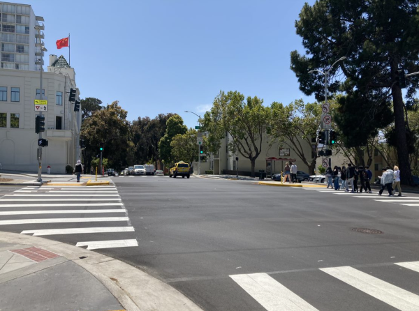 Photo: People walking across newly installed pedestrian refuges at Laguna Street at Geary Boulevard
