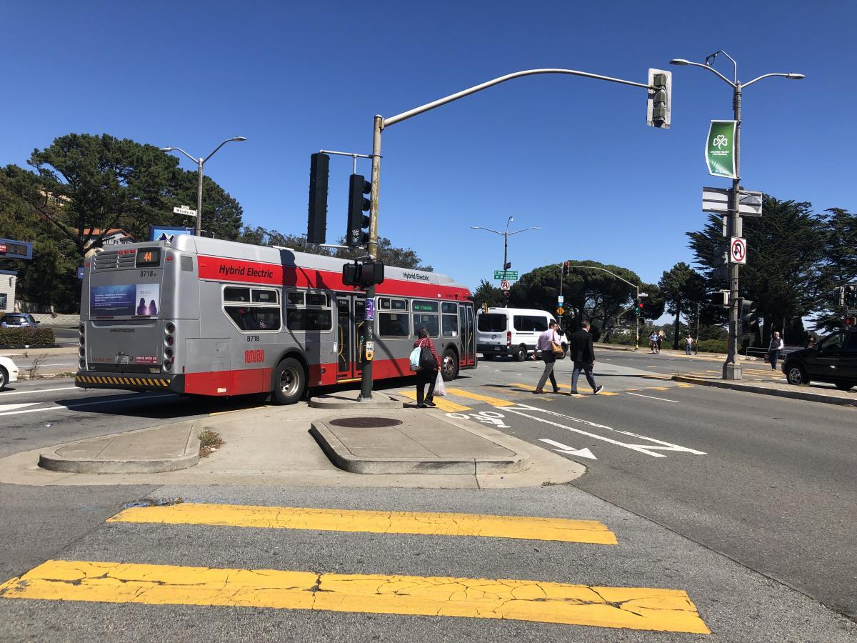 Bus driving through intersection.