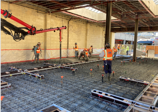 Workers work on installing rebars