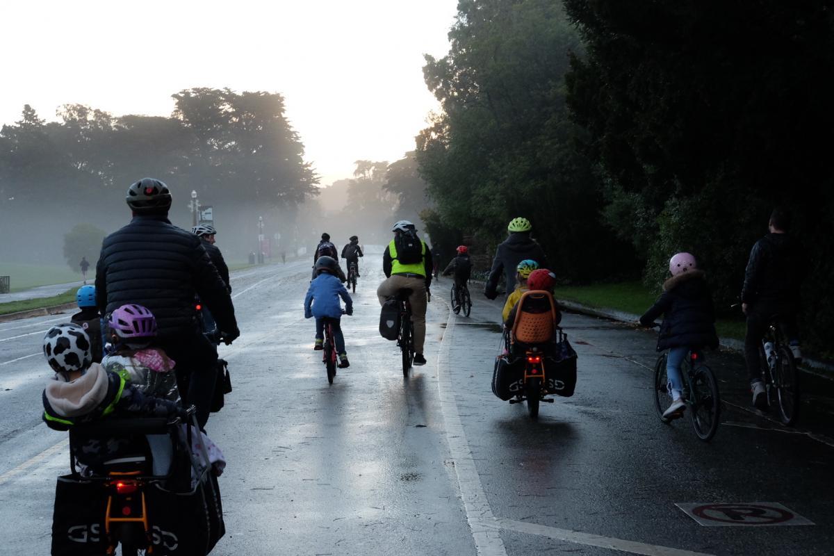 Families and kids biking down car-free JFK Drive in Golden Gate Park