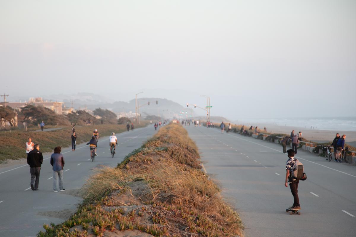 People walking, biking, and rolling along the Upper Great Highway when closed to vehicles
