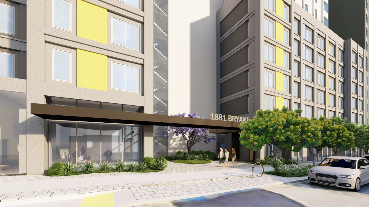 image of a large multi-use urban building.showing a residential entrance with pedestrians walking