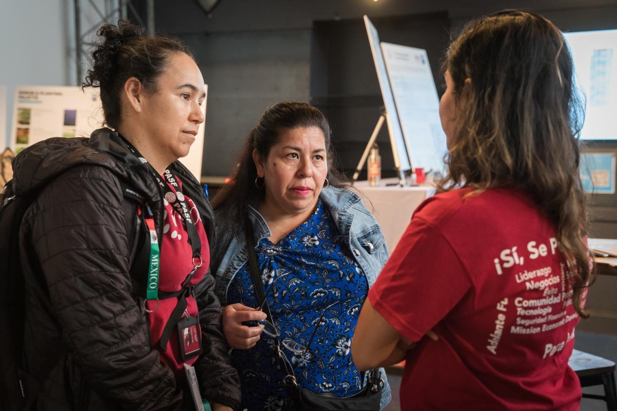 MEDA Representative speaking to staff at the event