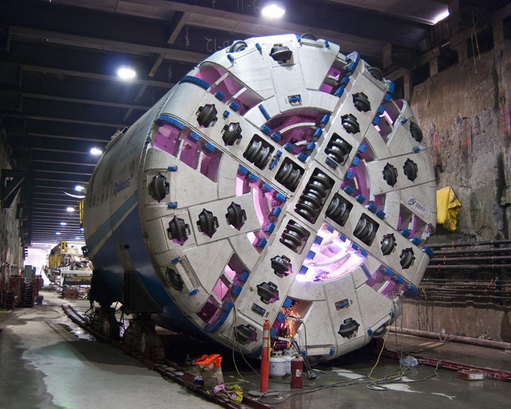 The forward portion of tunnel boring machine Mom Chung is seen being assembled.