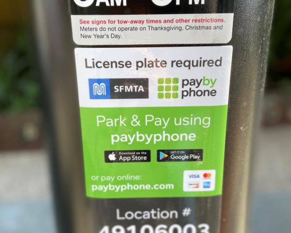 Parking meter decal showing payment information