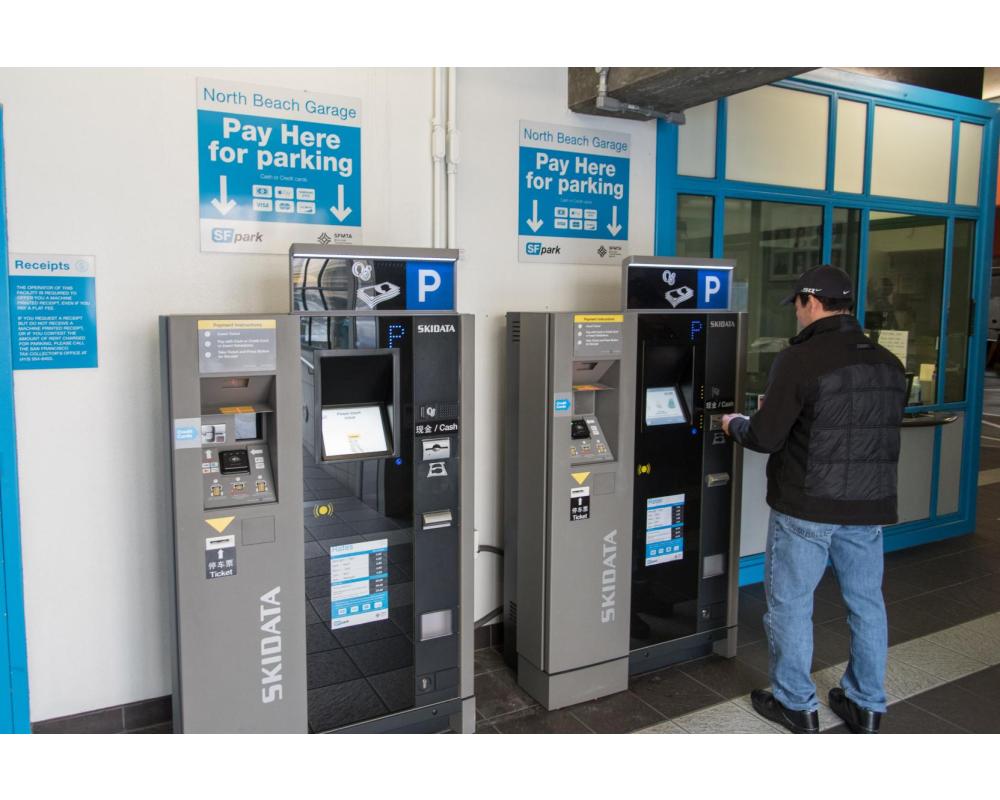 Customer Using New PARCS Payment Equipment at North Beach Parking Garage