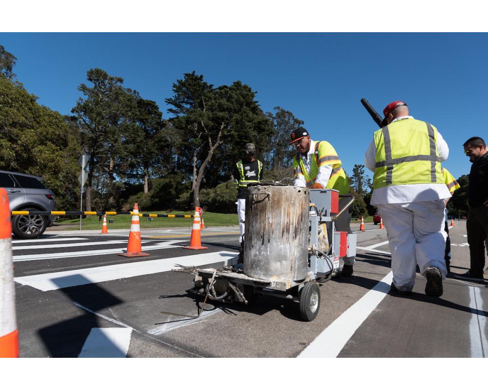 Paint crews working on a crosswalk