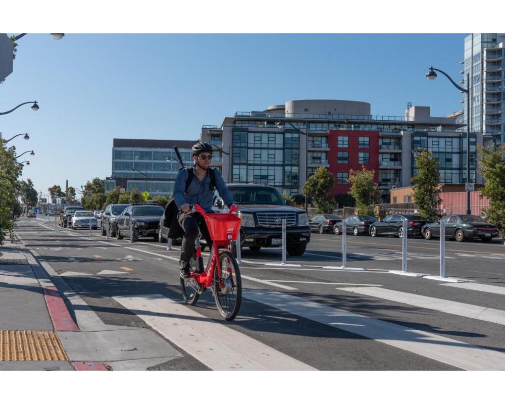 A person riding a JUMP bike on Terry Francois Blvd.