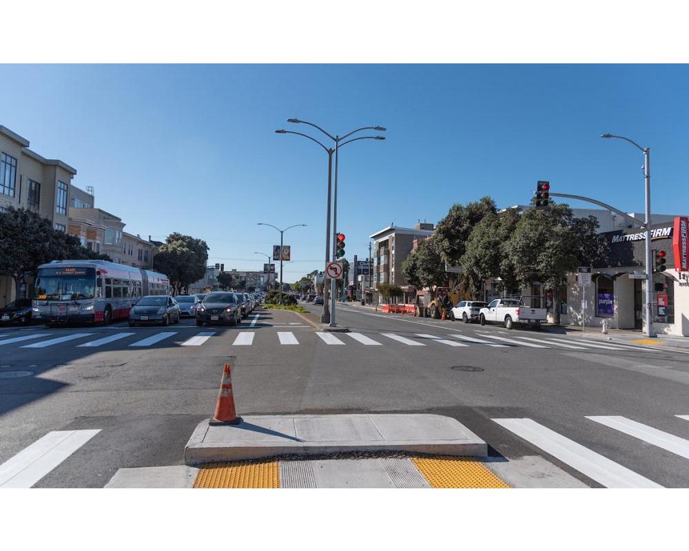Image of cars stopped at new traffic signal at Cook Street