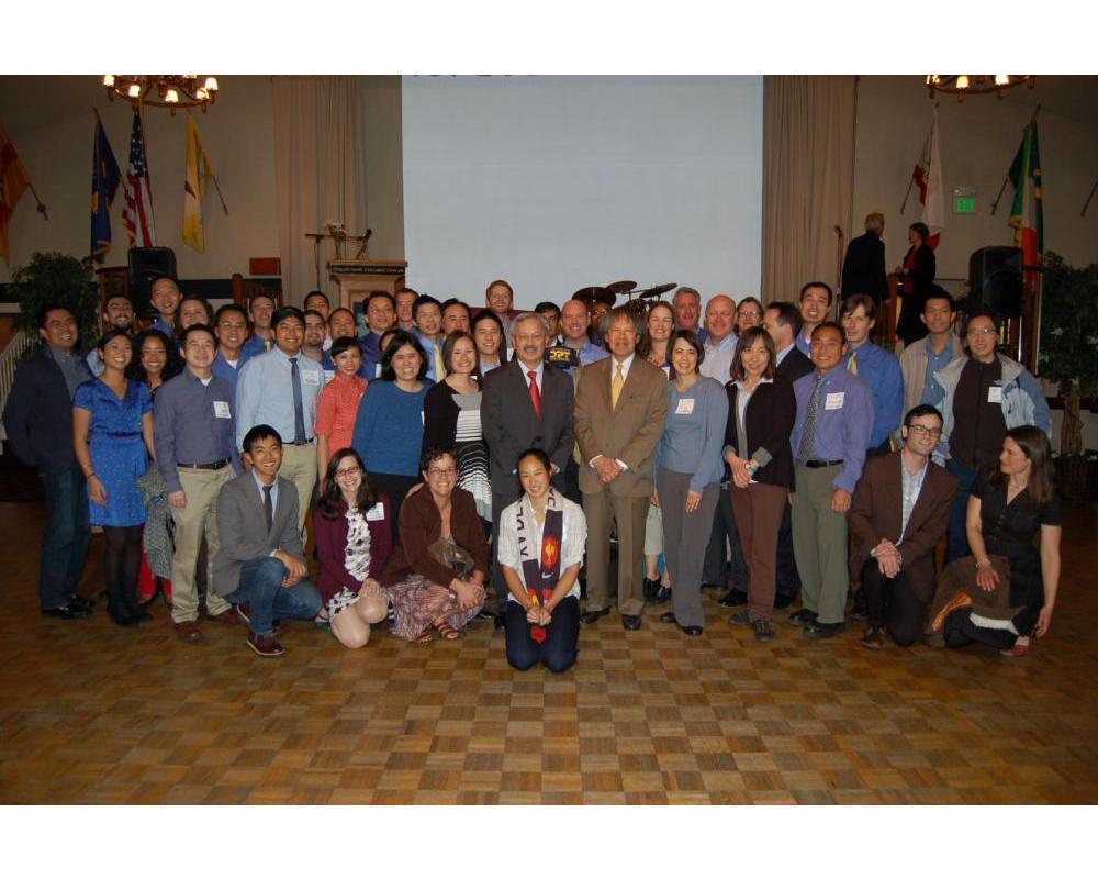 Photo of Bond Yee and several City staff