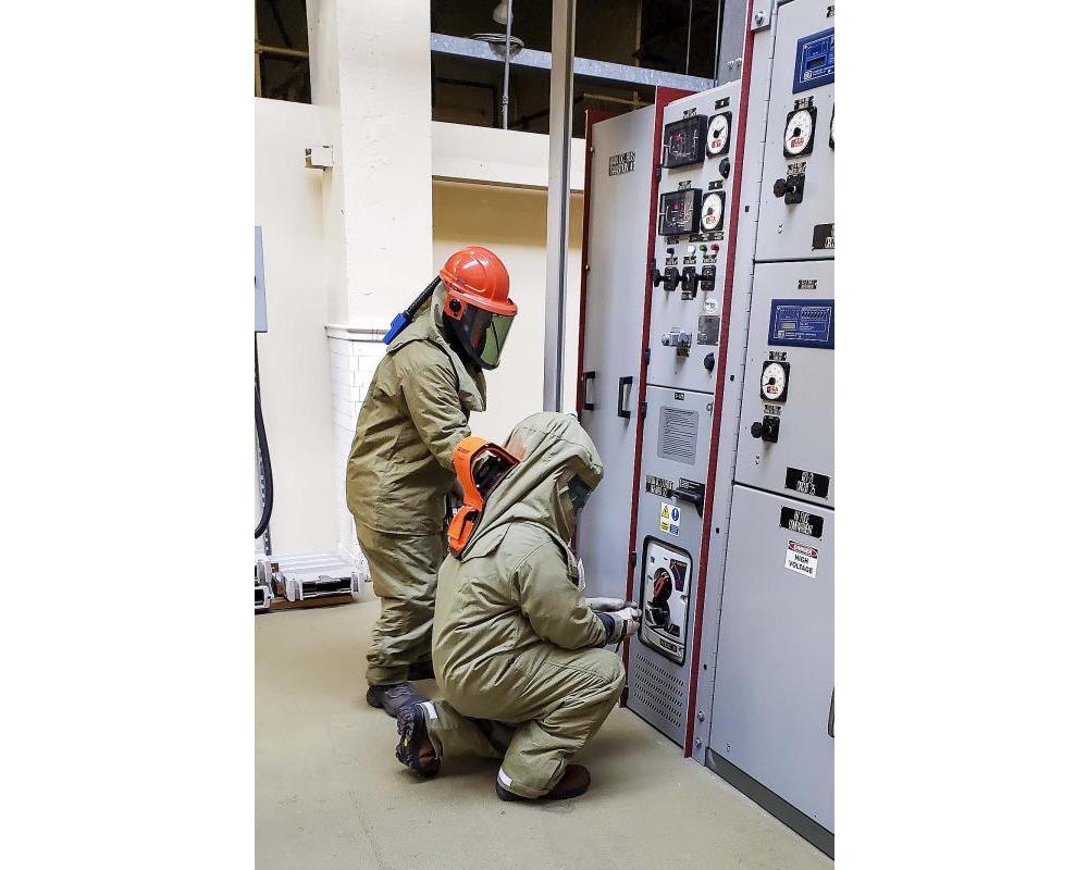 MOW Motive Power staff rack out a breaker to turn off the overhead power in the subway 