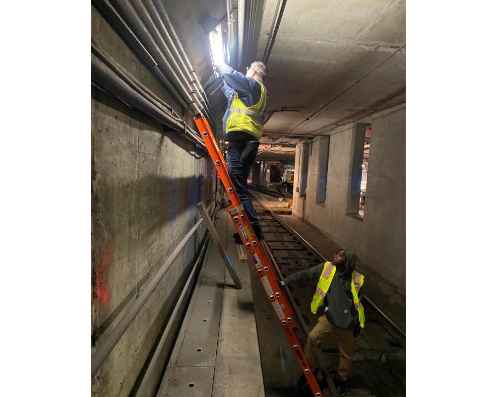 Subway engineers from Mechanical Systems restore and replace lighting systems throughout the tunnel
