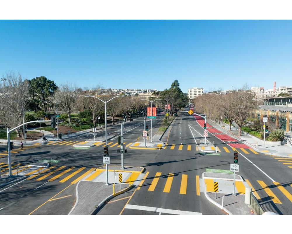  Geary at Steiner Street after the Geary Rapid Project. The seldom-used pedestrian bridge was removed and improved crosswalks with pedestrian refuges were built in its place.